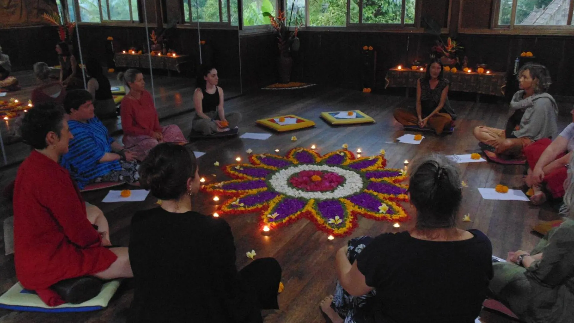A meditation circle around a Balinese offering