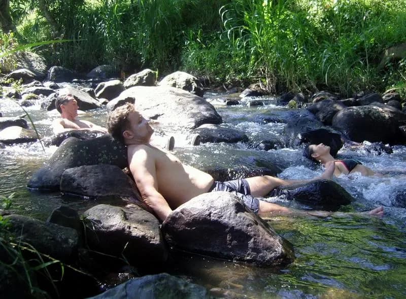 Bathing in a clear rocky jungle river