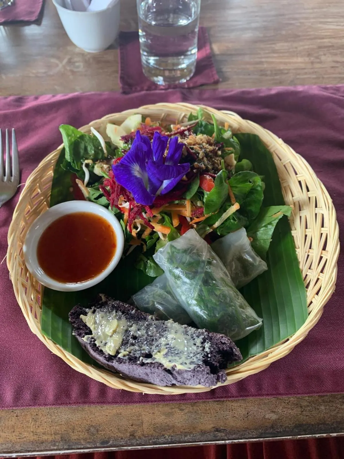 Garden salad with fresh spring rolls and butterfly-pea flower