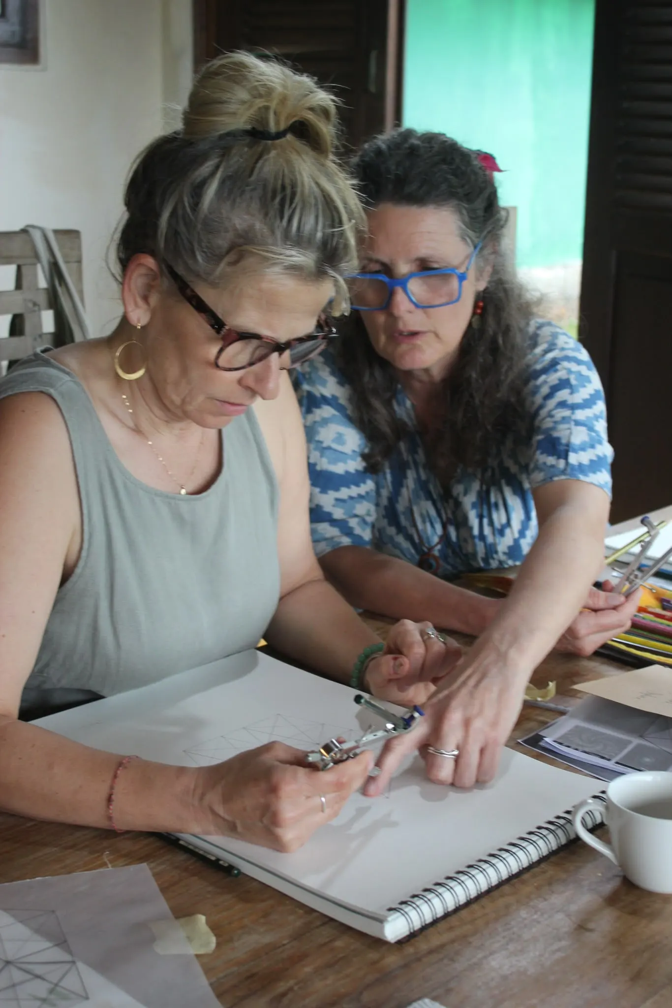 Drawing a spiral with a compass at the workshop table
