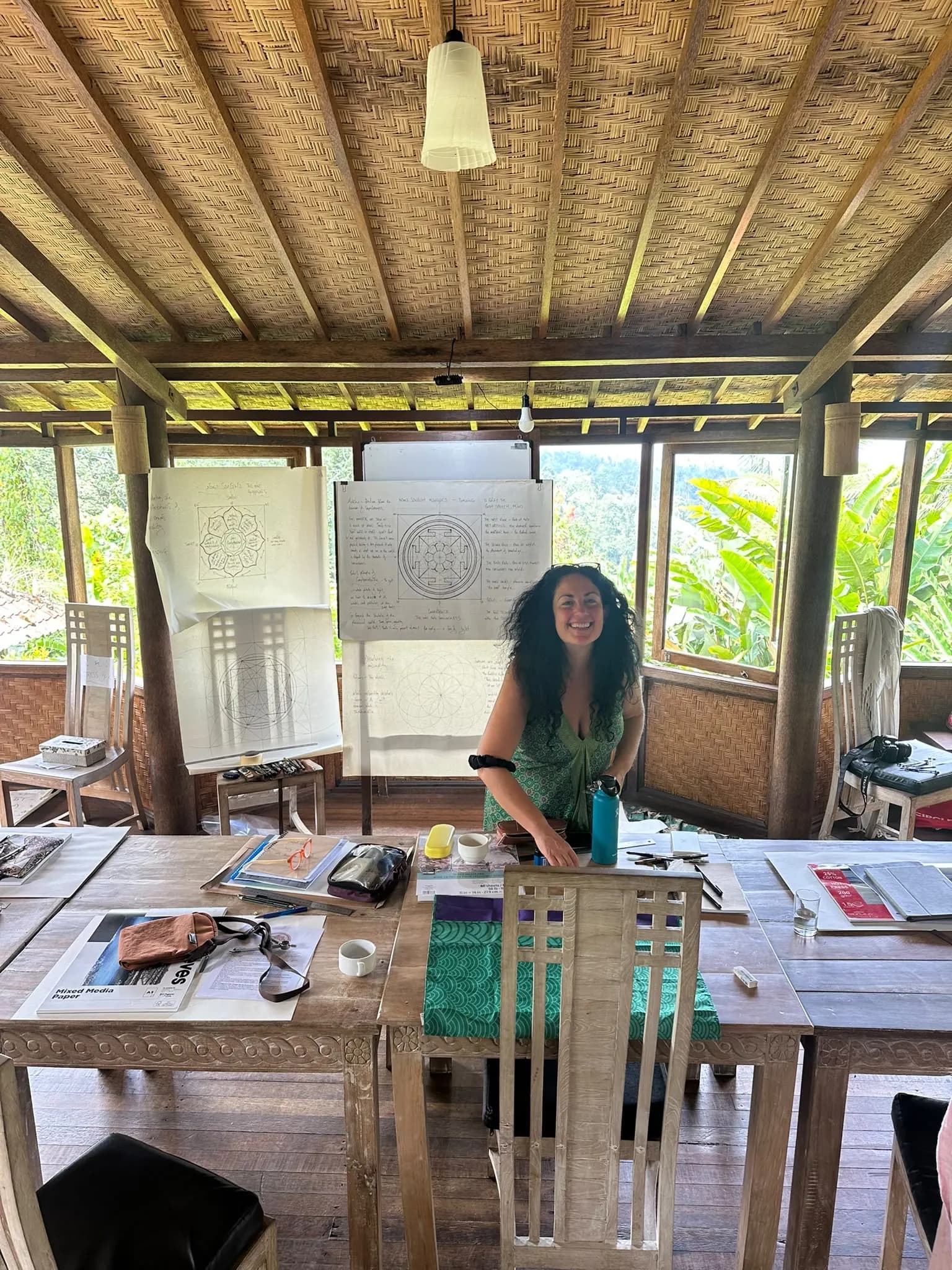The workshop teacher in the upstairs studio beneath its woven bamboo ceiling