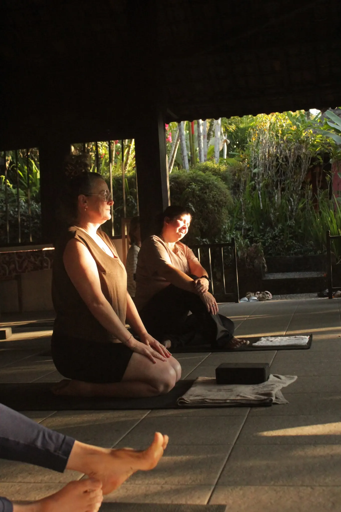 Yoga mats in the open pavilion in low golden sunlight