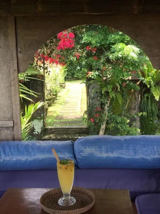 A tall glass of fresh tropical fruit juice